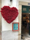 Vertical shot of a heart made of flowers in the streets of Lisbon