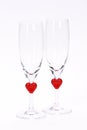 Vertical shot of heart-themed champagne glasses