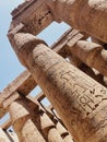 Vertical shot of the hieroglyphs and symbols on the columns of the Karnak temple