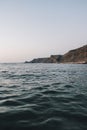 Vertical shot of hills of Praia da Cordoama against a sea in Portugal Royalty Free Stock Photo