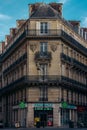 Vertical shot of a historic building in Paris, France, featuring a classic architecture style