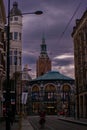 Vertical shot of historic buildings near a road at sunset in Denhaag, Netherlands Royalty Free Stock Photo