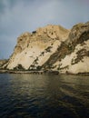 Vertical shot of historic castle ruins on a cliff over water at the Tremiti Islands in Puglia, Italy Royalty Free Stock Photo