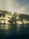 Vertical shot of historic castle ruins on a cliff over water at the Tremiti Islands in Puglia, Italy Royalty Free Stock Photo