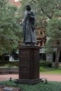 Vertical shot of the historic John Wesley Statue in Reynolds Square, Savannah, Georgia