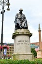 Vertical shot of the historic statue of James Watt in Glasgow, Scotland