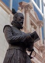 Vertical shot of the historic statue of Miguel de Cervantes in Madrid, Spain