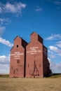 Vertical shot of Historic wooden grain elevators in the ghost town of Rowley, Alberta with blue sky Royalty Free Stock Photo