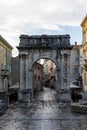 Vertical shot of the historical gate entrance of the city of Pula