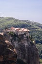 Vertical shot of Holy Monastery Varlaam situated at top of a rocky precipice that is 373 meters above Pineios valley floor.
