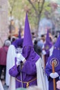 Vertical shot of a hooded penitent during the Holy Week in Madrid