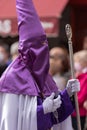 Vertical shot of a hooded penitent during the Holy Week in Madrid