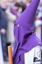 Vertical shot of a hooded penitent during the Holy Week in Madrid