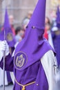 Vertical shot of a hooded penitent during the Holy Week in Madrid