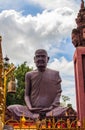 Vertical shot of a huge statue in Prasat wat sa kamphaeng Yai in Sisaket, Thailand