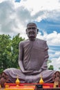 Vertical shot of a huge statue in Prasat wat sa kamphaeng Yai in Sisaket, Thailand