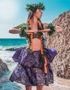 Vertical shot of the Hula dancer on the beach. Royalty Free Stock Photo