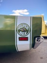 Vertical shot of an iconic vintage green Super Bee Dodge car outdoors