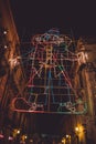 Vertical shot of an illuminated decoration for carnival in Acireale, Sicily, Italy