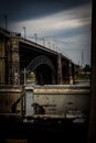 Vertical shot of an industrial train and a bridge in St Louis, United States in moody colors