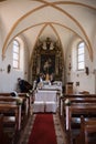 Vertical shot of inner part of a sanctuary in Bolzano, Italy prepared for a wedding