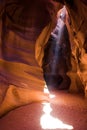 Vertical shot of the inside of beautiful textural canyons with light peeking through