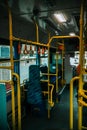 Vertical shot of inside of empty public bus Royalty Free Stock Photo