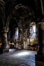 Vertical shot of the inside of the historic Geghard Monastery in Armenia