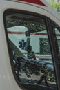 Vertical shot of an interior of an ambulance in Split, Croatia. Parked in the public parking lot, reflection of the trees on the