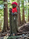 Vertical shot of a Japanese Jizo statue along the hiking trails on Mt. Oyama in Isehara, Japan