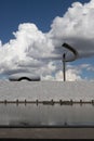 Vertical shot of the JK Memorial against fluffy clouds in Brasilia, Brazil