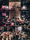 Vertical shot of kettles and bowls in the shelve of the shop