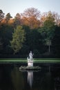 Vertical shot of the King Neptune statue in a lake at Fountain Abbey, England