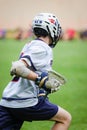 Vertical shot of a lacrosse player in the field