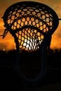 Vertical shot of the lacrosse stick with the beautiful sunset background Royalty Free Stock Photo