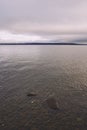 Vertical shot of the lake and cloudy sky. Toten, Norway.