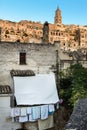 Vertical shot of laundry hanging outside a house at the historical city of Matera, italy Royalty Free Stock Photo