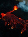 Vertical shot of lava flowing over rocky surface during 2022 Meradalir volcano eruption, Iceland Royalty Free Stock Photo