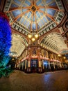 Vertical shot of the Leadenhall market on Christmas week with a decorated tree in London, UK. Royalty Free Stock Photo