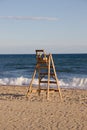 Vertical shot of a lifeguard wooden chair on a beach