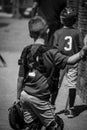 Vertical shot of a little league catcher resting between innings Royalty Free Stock Photo