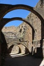 Vertical shot of Loarre Castle ruins with semicircular arches on a sunny summer day Royalty Free Stock Photo