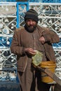 Vertical shot of a local Pakistani vendor standing in the streets of Swat City, Pakistan