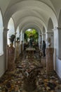 Vertical shot of Loggia in Villa San Michele with antique statues and sculptures