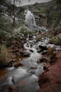 Vertical shot of a long exposure waterfall flowing over rocky surface in Perth, Australia Royalty Free Stock Photo