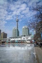 Vertical shot of a low angle view of the CN Tower in Toronto under the calm sky