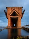 Vertical shot of the Lower Harbor Ore Dock surrounded by the sea with long exposure in Michigan Royalty Free Stock Photo