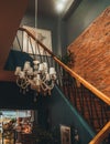 Vertical shot of the luxurious interior of a cafe with wooden steps in Ho Chi Minh City, Vietnam