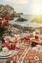 Vertical shot of a luxurious romantic picnic on a seashore
