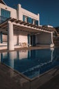 Vertical shot of a luxury villa with a pool in Greece